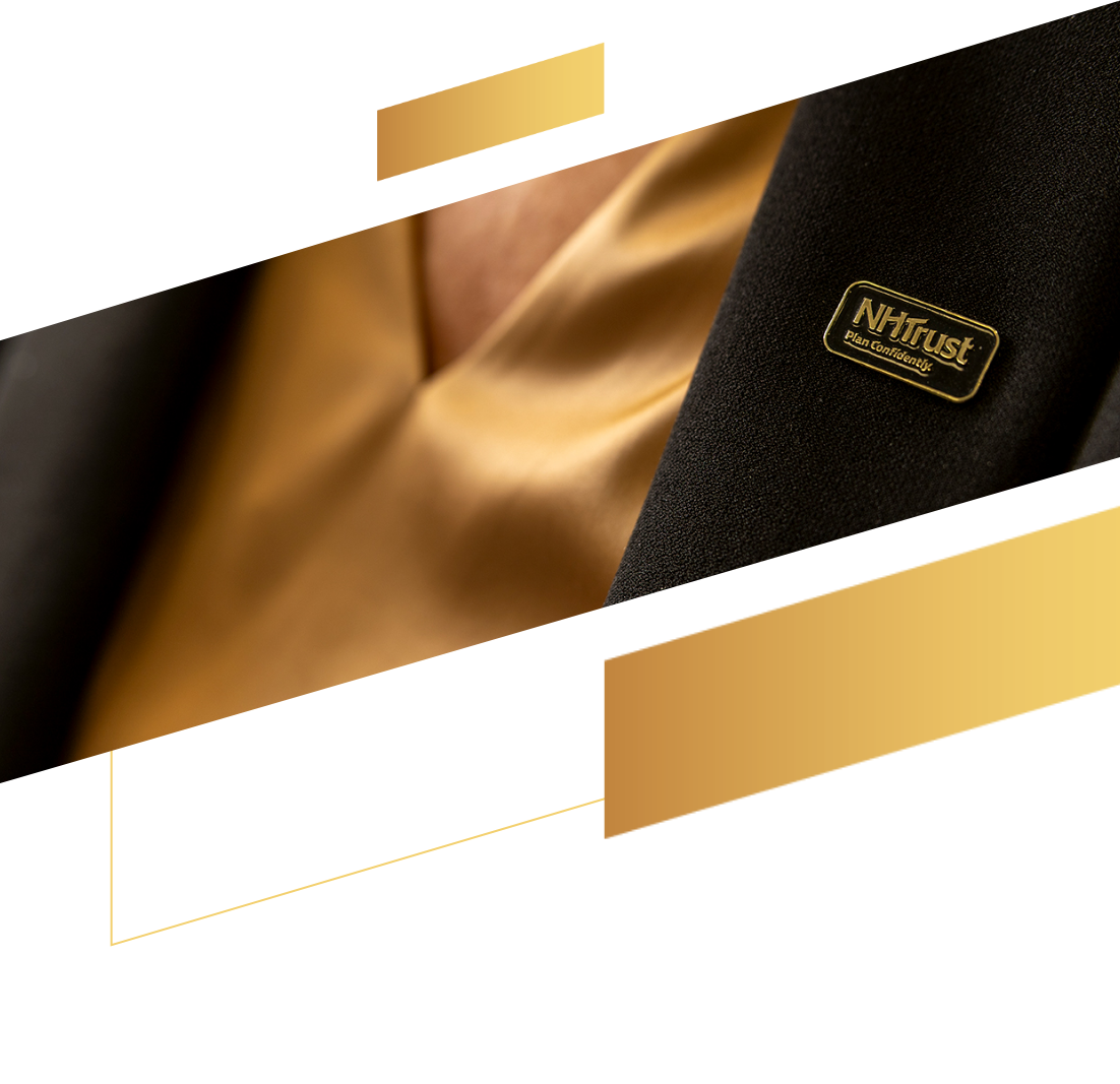 Close-up of a person in a gold shirt and dark blazer wearing an NTrust Data Certified pin.